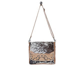 MANGNIFIQUE HAND-CONCEALED BAG